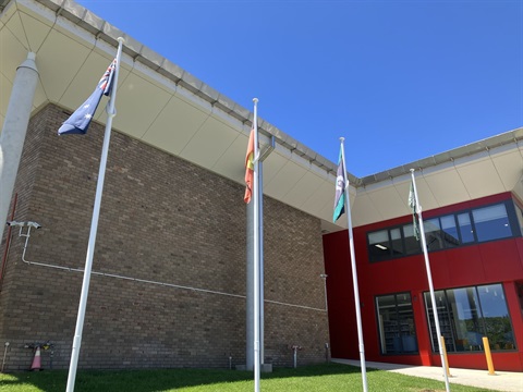 Flag poles outside the Civic Centre building in Moss Vale NSW 