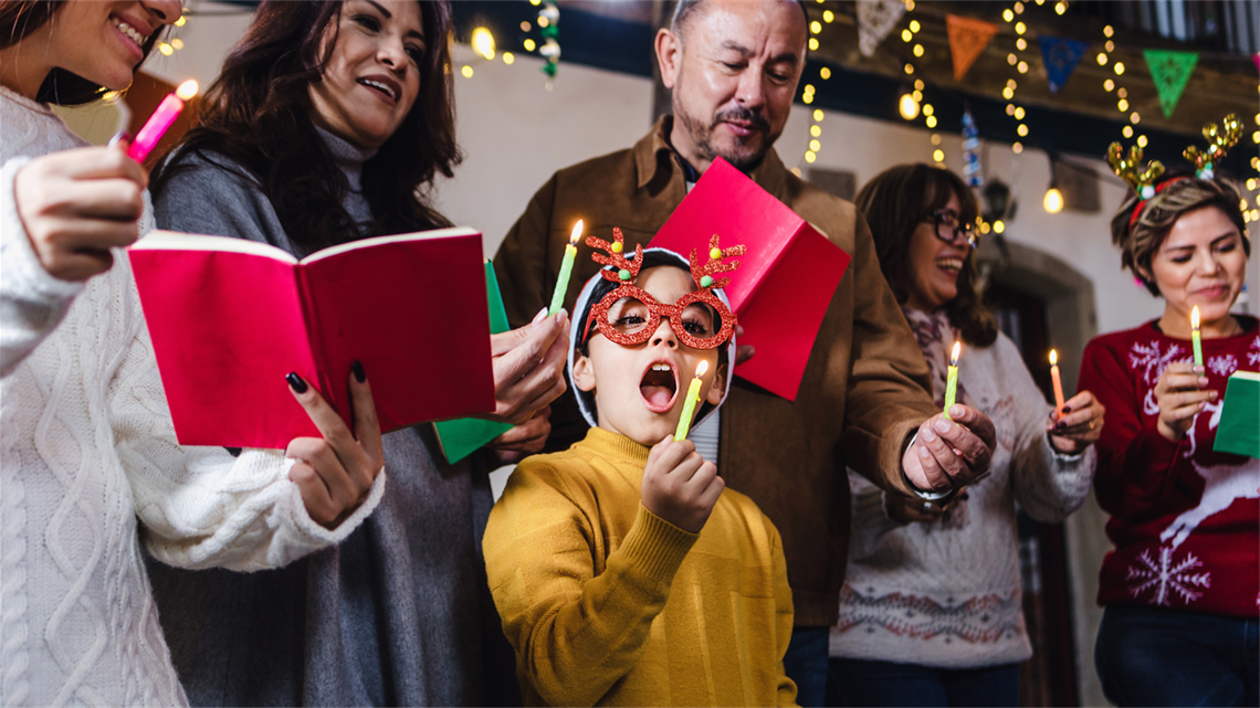 Stock image of a group of carol singers of various ages 