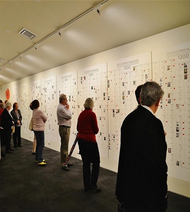 People enjoying a display wall at the Berrima Museum