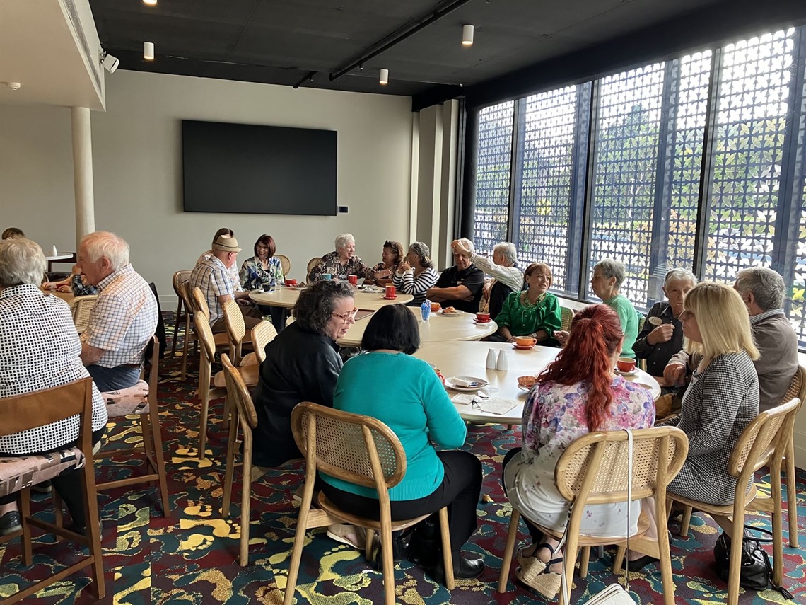 Seniors Festival Italian Group image of people sat around a table in a casual setting as part of the Wingecarribee Shire CouncilSeniors Festival