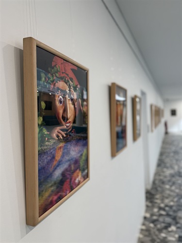 Wall of photos and puppets in cabinet from Celebrating the Art of Puppetry Atrium Exhibition