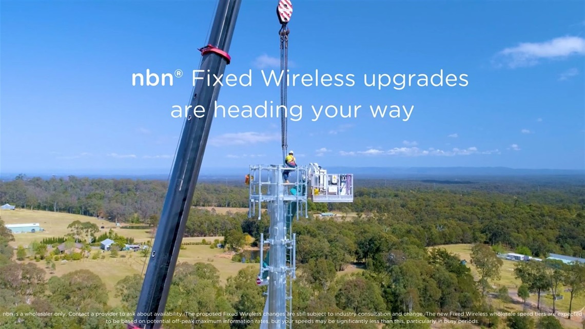 A person working at a communication tower