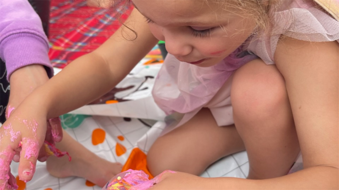 Little girl playing with slime