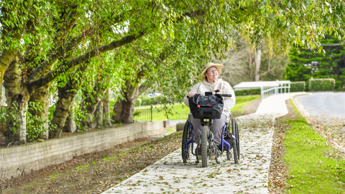 Lady in a wheelchair enjoying the new footpath