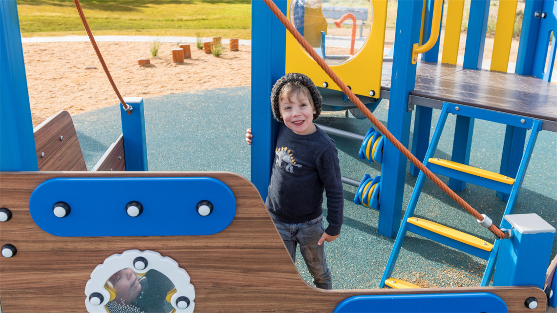 Young kids playing at the new playground