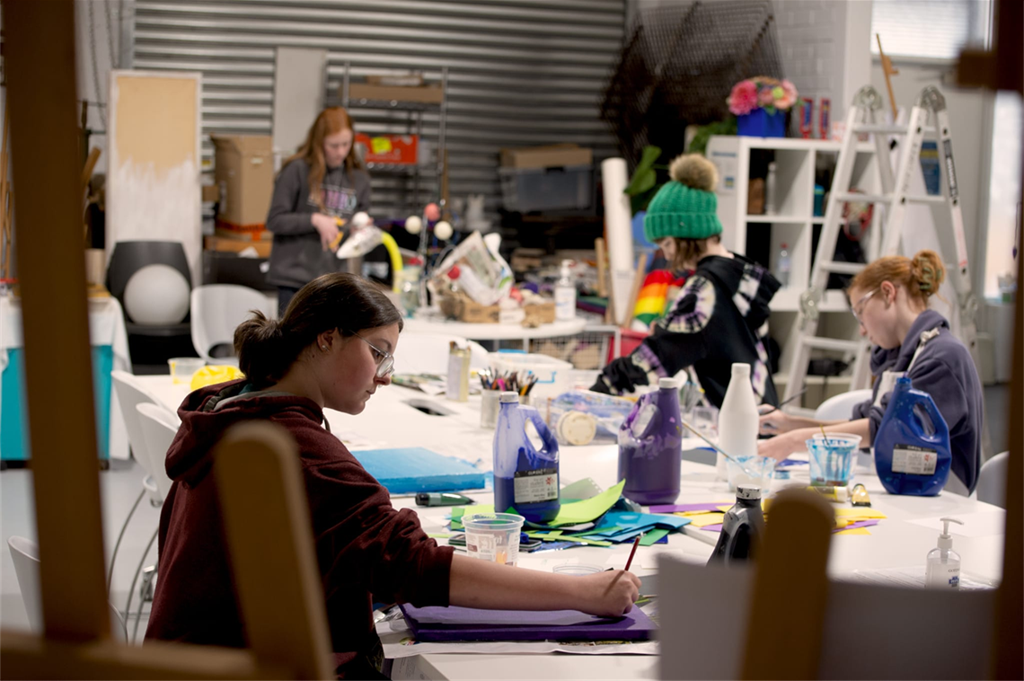 Image of young people taking part in a creative workshop