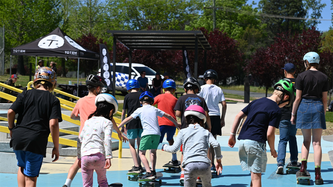 A group of kids skateboarding