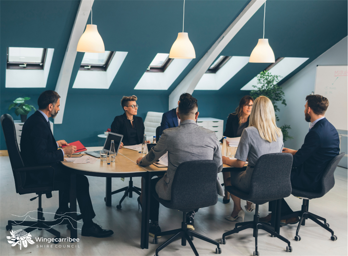 People sitting around a table having a meeting