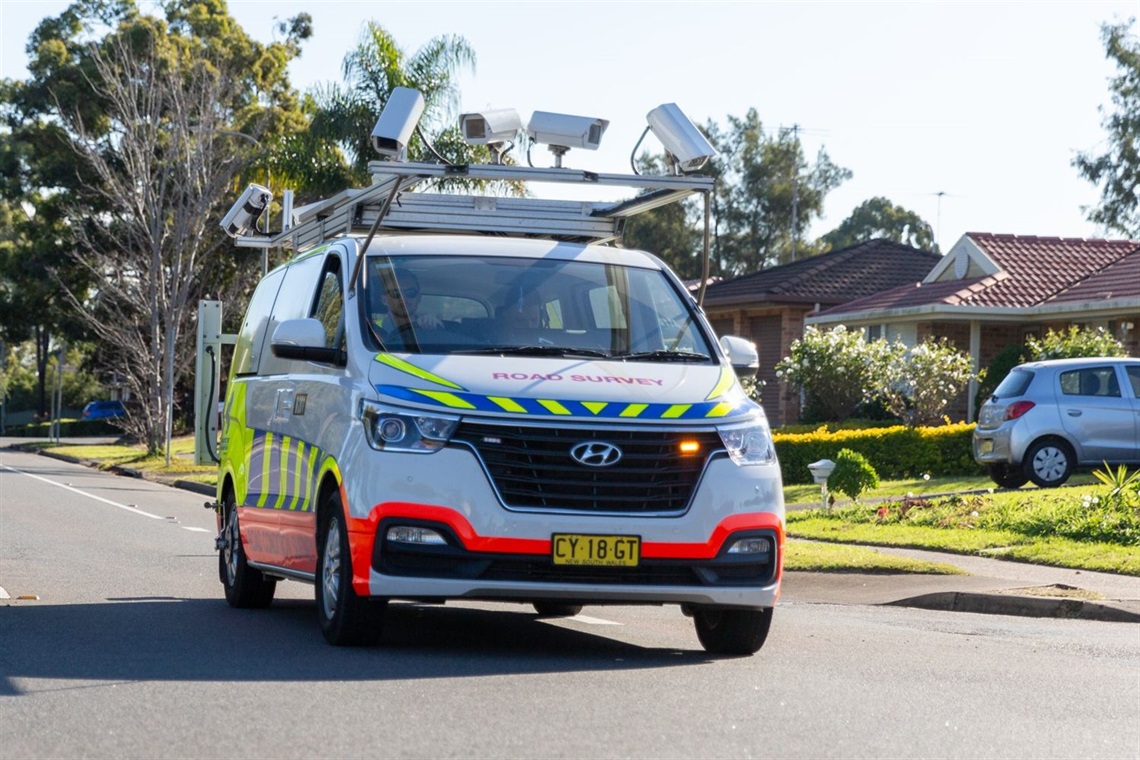 Road survey vehicle on suburban street