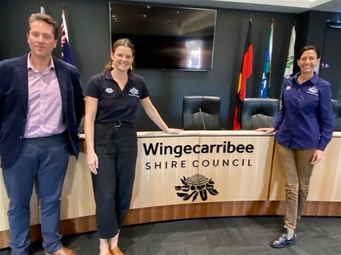 Dr Bruisma and two council staff standing at WSC desk