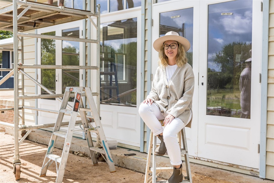 Lady sitting next to her home renovations