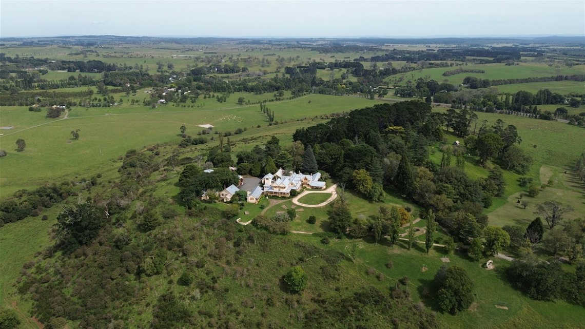 Drone shot of Hillview Estate, large country estate surrounded by lush green land and trees